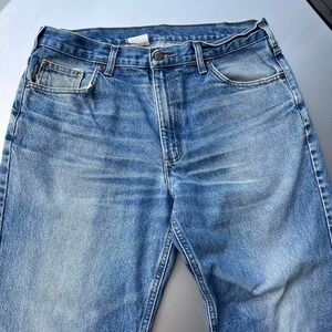 2000s distressed faded Blue Carhartt jeans with a relaxed fit